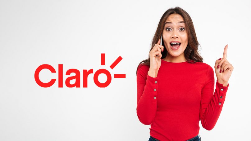 Mulher segurando um celular para fazer um ligação. Ao lado, o logo da operadora Claro.